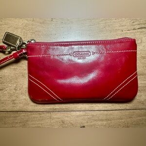 Coach dark red wristlet bag